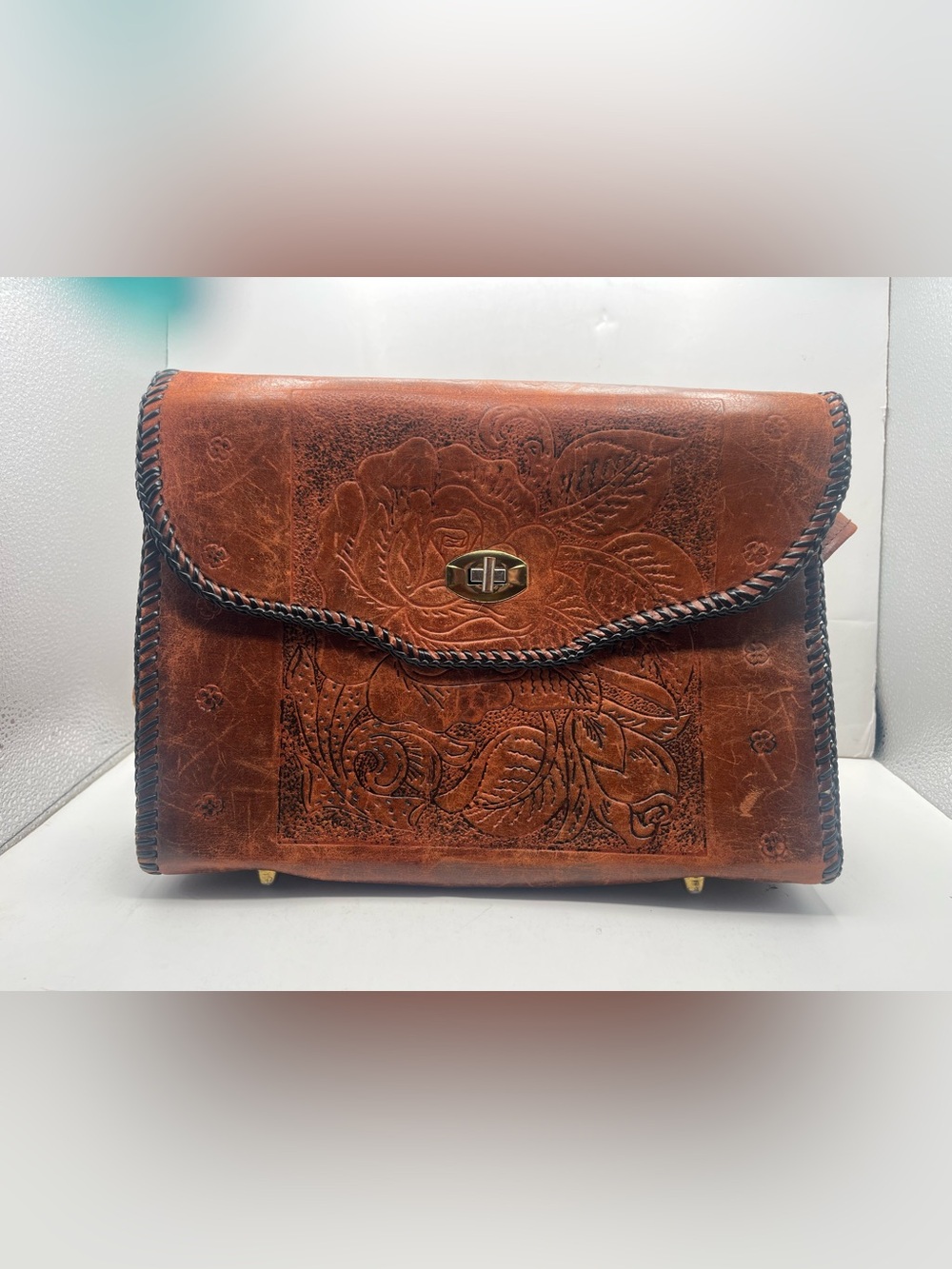 Hand-Tooled Floral Leather Clutch in Cognac Brown